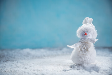 a snowman in the snow. New Year's, Christmas winter background