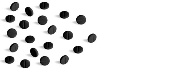 Black pills or capsules. Activated carbon. on isolated transparent background