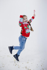 Preschool caucasian girl in Christmas sweater