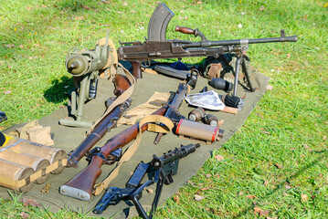 Display of WW2 equipment including a Bren light machine gun, grenade launcher, Lee Enfield rifle