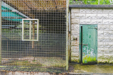 Cage at an old, Victorian style zoo, which has since been closed and abandoned.