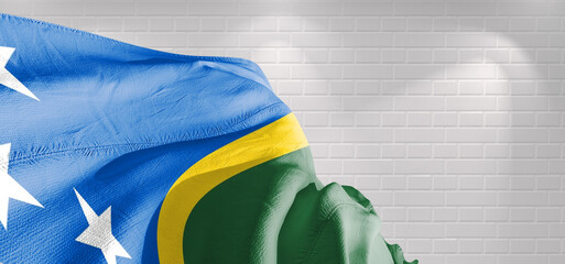 Solomon Islands national flag cloth fabric waving on beautiful lighting Background.