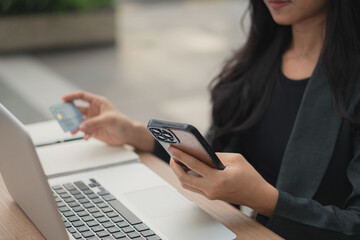 A person using a payment card to pay online