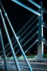 modern metal cable bridge Kaczorowskiego at night, abstract geometry, Lubln