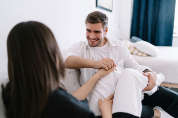 Cheerful couple relaxing on couch