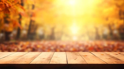 Fotobehang The empty wooden table top with blur background of autumn. Exuberant image. autumn landscape. Concept Autumn nature and product advertising. copy space.. © TEERAPONG