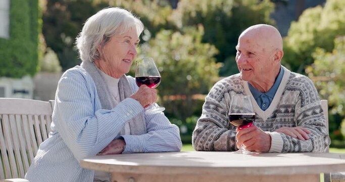 Senior couple, toast and wine in garden with smile, marriage and communication for care in retirement. Elderly people, love or relax together in nature by alcohol glass, wellness or happy in sunshine