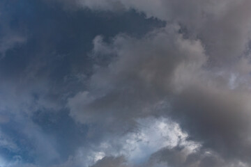Naklejka na ściany i meble overcast sky, full-frame gray clouds background and texture.