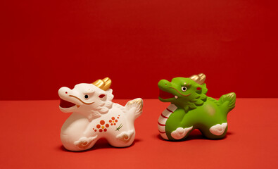 Japanese new year material. Zodiac dragon on red background. 日本のお正月素材。赤色背景上の干支の辰。