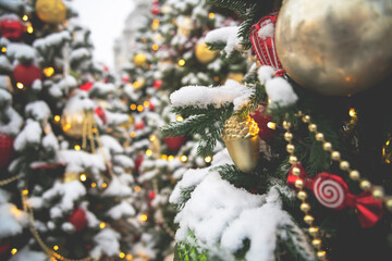 New Year's composition outdoors. Christmas trees in the snow, Christmas toys