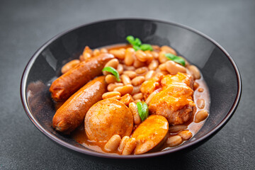cassoulet thick bean soup meat, beans, sausages eating cooking appetizer meal food snack on the table copy space
