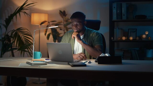 Man looking on laptop and feeling inspiration during work