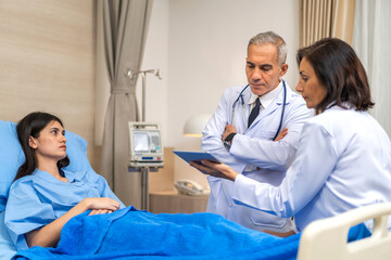 Obraz premium Senior man doctor wearing uniform with stethoscope help discussing and consulting talk to sick woman patient checkup information, support, care, diseases, treatment in hospital.healthcare