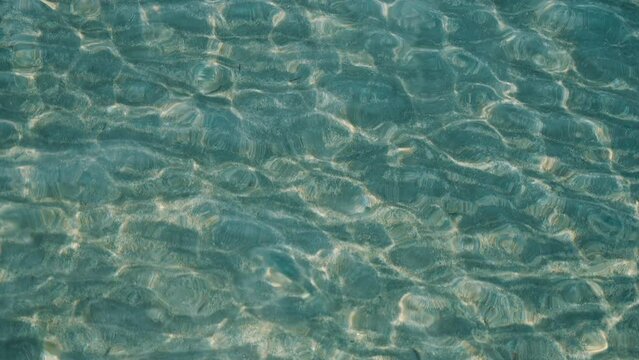Caustics in transparent water of a lake