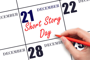 December 21. Hand writing text Short Story Day on calendar date. Save the date.