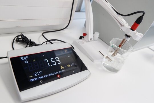 Scientist used chemical solution and lab testing for water quality or ph meter in laboratory ,research and science concept