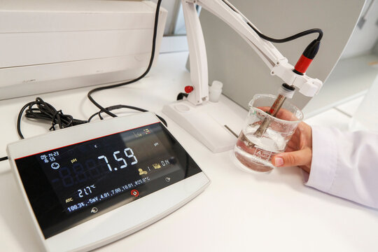 Scientist used chemical solution and lab testing for water quality or ph meter in laboratory ,research and science concept