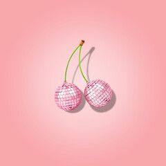 Decorative disco balls like cherries on pink background. Minimal party concept.