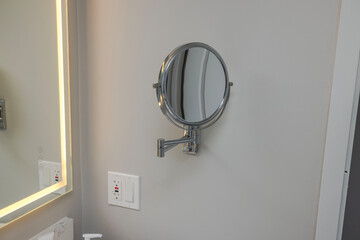 Interior view of hotel bathroom equipped with mirror for comfortable hygiene routines for hotel...