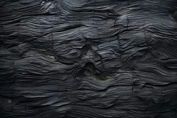 Wandaufkleber Rough textured uneven surface of burnt wood. Background with copy space © top images