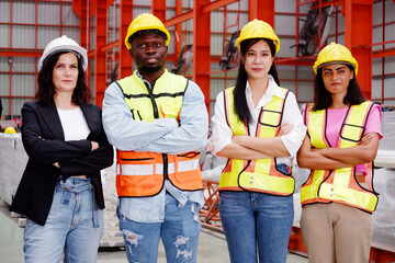 The engineering team and employees are happy to wear safety helmets. Smiling, happy working in the...