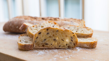 Fresh loaf of bread on wooden board