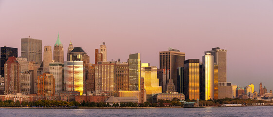Panoramic view of Lower Manhattan West side and Financial District across Hudson river at sunset, New York city, USA - 677187110