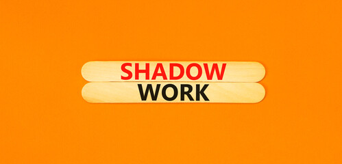 Shadow work psychology symbol. Concept words Shadow work on beautiful wooden stick. Beautiful orange table orange background. Psychology shadow work concept. Copy space.