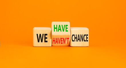 We have or not chance symbol. Concept word We have or have not chance on beautiful wooden cubes. Beautiful orange table orange background. Business and we have or not chance concept. Copy space.