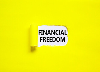 Financial freedom symbol. Concept words Financial freedom on beautiful white paper. Beautiful yellow paper background. Business financial freedom concept. Copy space.