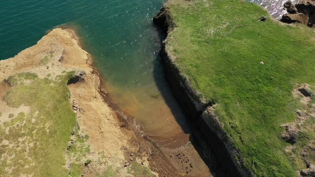 Aerial view of hydro power plant damb with water passing through it in Chile.