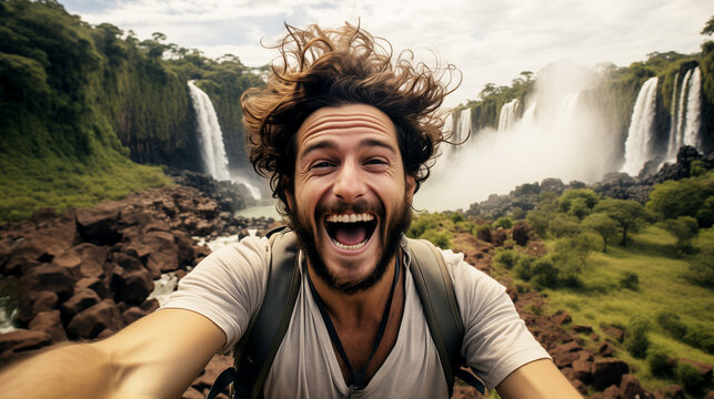 The lifestyle of a man who enjoys traveling. A close-up of a smiling man on a waterfall's background