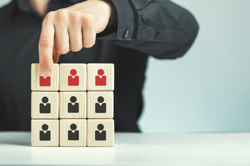 Assembled wooden cubes on the theme of business leadership