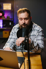 Portrait of male blogger in home studio.