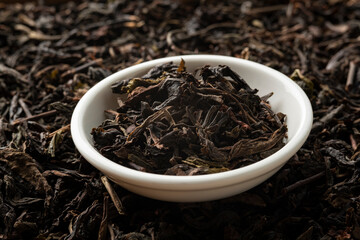 Dried tea leaves in white bowl,low grade and inexpensive price