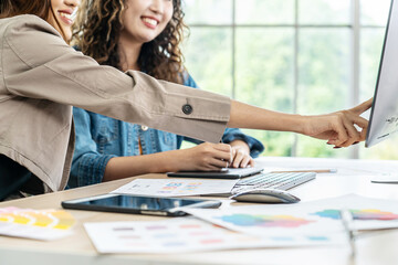 Collaboration of graphic design business people with computer in an office company. Two corporate women in creative marketing team working on project management, Designer teamwork, web design