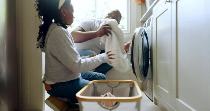 Laundry, washing machine and a father in the home with his girl child for spring cleaning or housework together. Black family, a man and daughter in a washroom for a housekeeping or chores routine