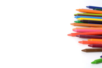 Crayons lined up isolated on white background.