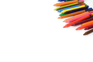 Crayons lined up isolated on white background.