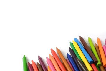 Crayons lined up isolated on white background.
