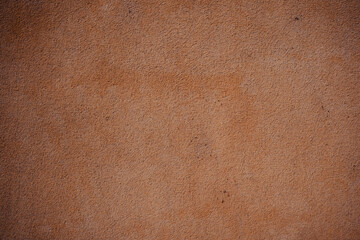 A close-up of a textured brown surface with a sleek black border