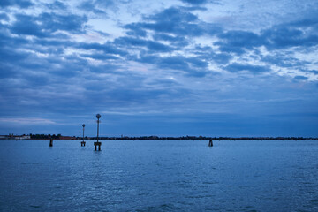 Dramatic sky in Venetian lagoon. Beautiful landscape of Guidecca canal, Venice