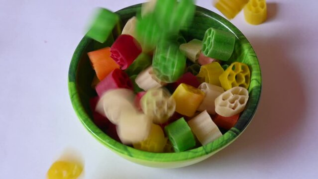 Raw fryums snack. It's deep fried, and they are either eaten as a snack or served like a&nbsp;papadum&nbsp;to accompany a meal. Indian&nbsp;snack composed primarily of&nbsp;potato starch, sago. slow motion video.
