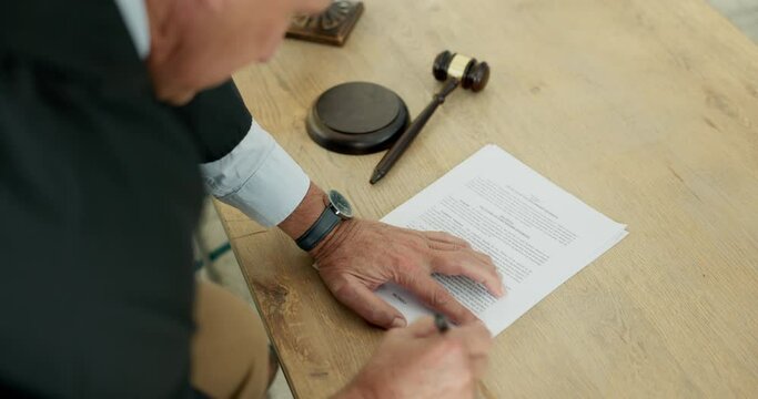 Legal signature, man or judge with a document, government paperwork or report for justice. Above, working and an attorney or lawyer writing on paper for a law, courtroom rules or constitution policy