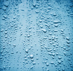 Raindrops on the hood of a car