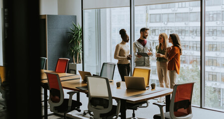 Young multiethnic startup team working in the modern office