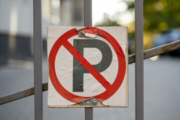 no parking old and damaged homemade sign