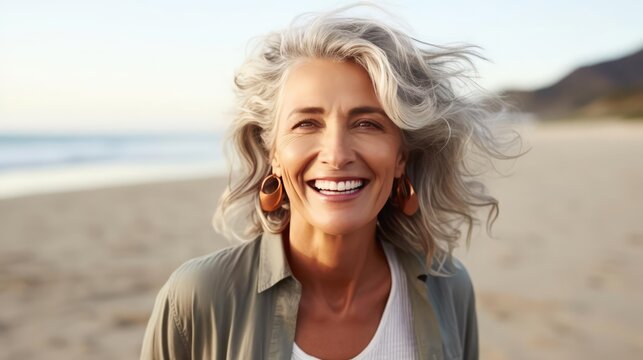 image of happy mature woman at the beach