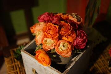Close-up shot of Persian buttercup in a wooden box
