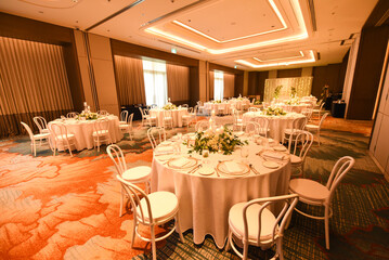 Indoor wedding ballroom with table decorations